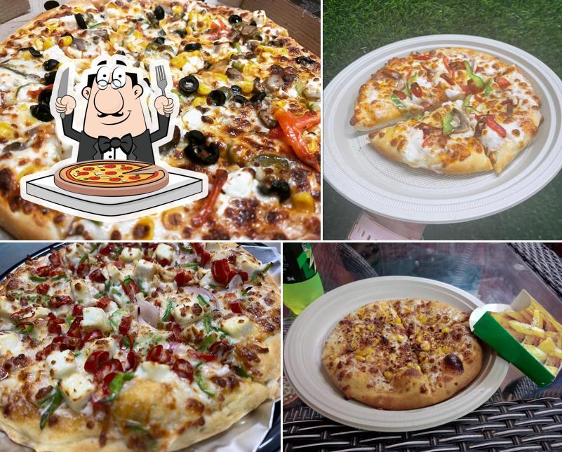 Try out pizza at Pizza House Cafe