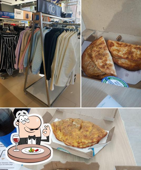 Take a look at the photo depicting food and interior at Domino's Pizza Sardarpura, Jodhpur