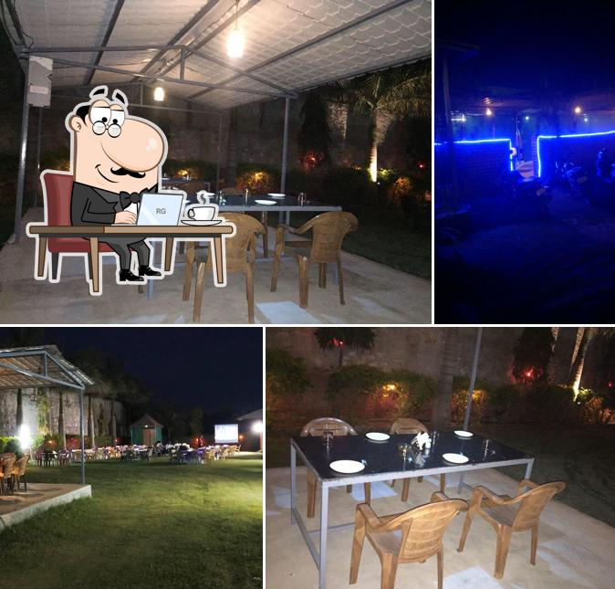 Take a seat at one of the tables at Kothi Resturant And Lounge