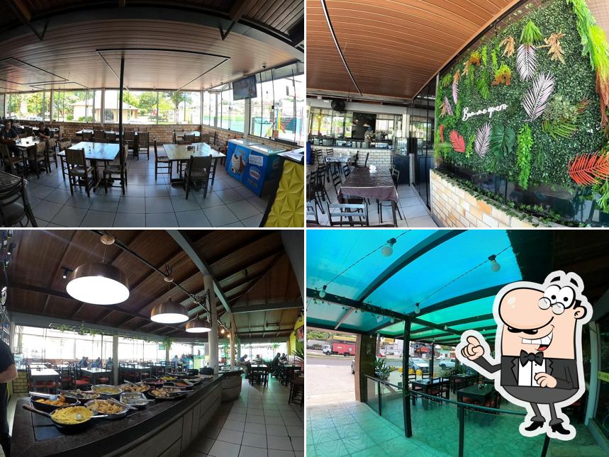 O interior do Luau Restaurante e Pizzaria