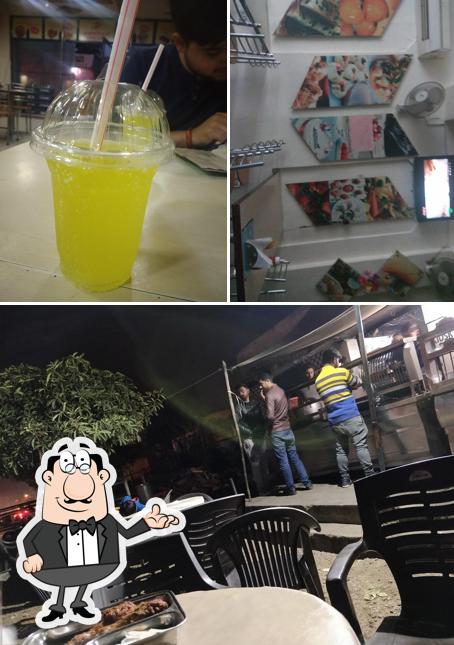 Take a look at the image showing interior and beverage at Amritsari Chicken Shop