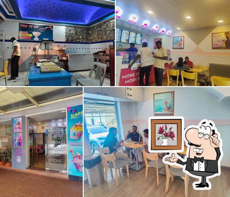 Take a seat at one of the tables at Baskin Robbins