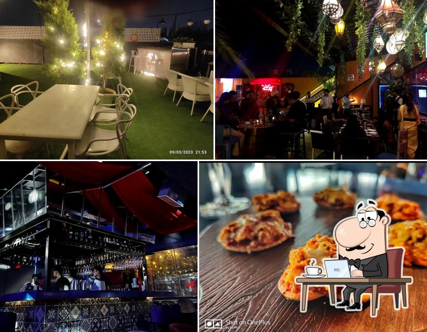 Take a seat at one of the tables at 18 Bodyguard Rooftop & Skybar