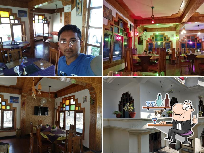 Take a seat at one of the tables at Tarang Hotel & Restaurant