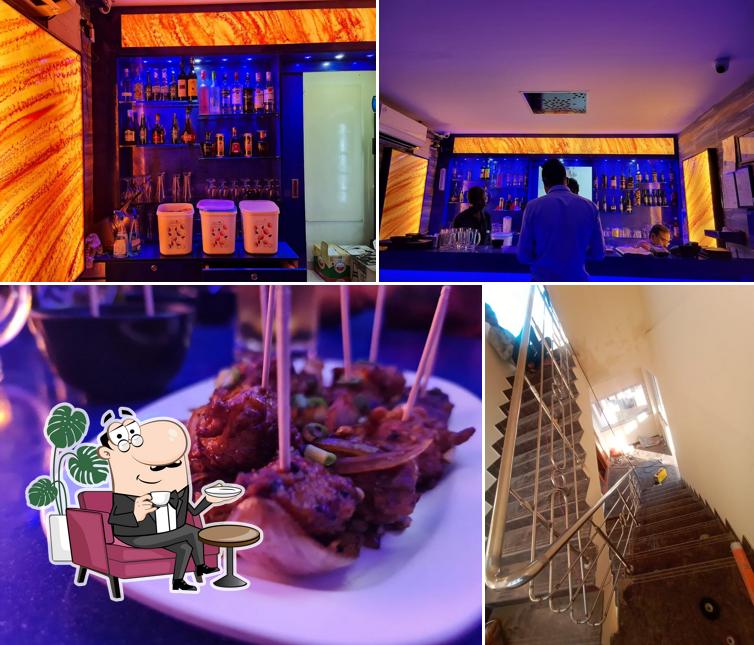 The photo of DEN the Bar @Hotel Sera Grand’s interior and food