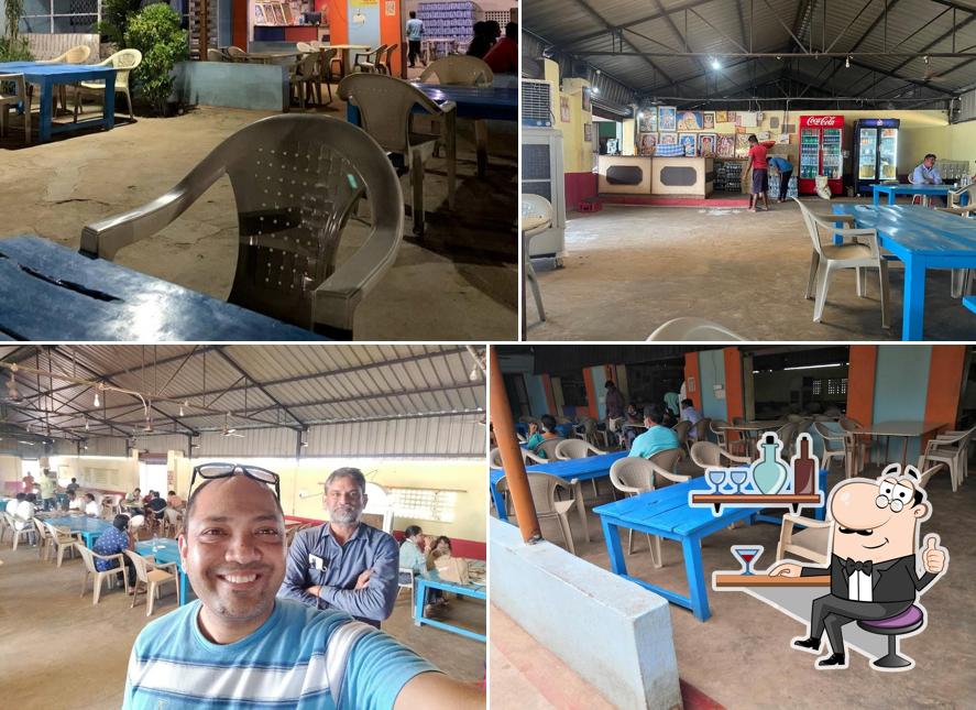 Take a seat at one of the tables at Orissa Dhaba Veg and Non Veg