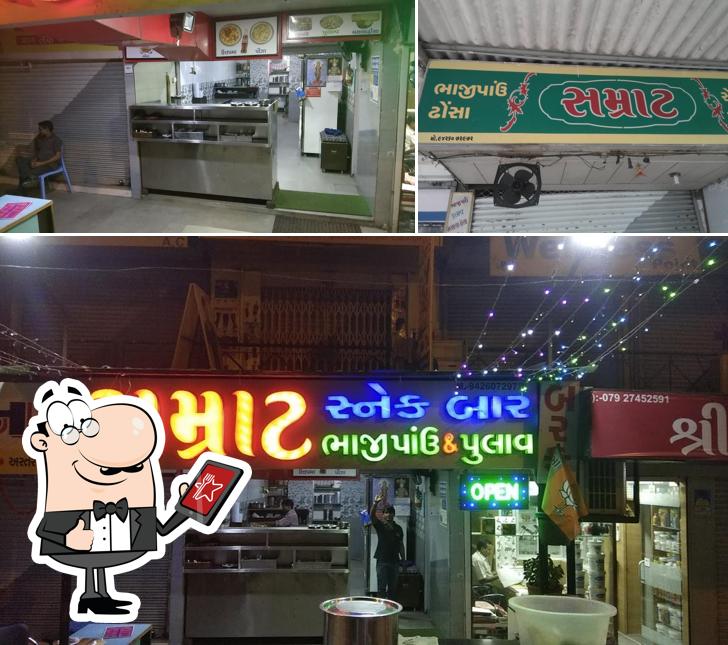 This is the image depicting exterior and interior at Samrat Snack Bar
