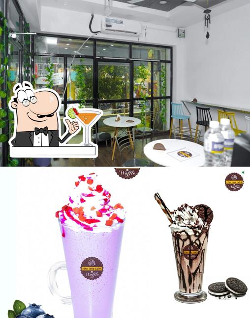 Check out the photo displaying drink and interior at The Town Cafe & Waffle