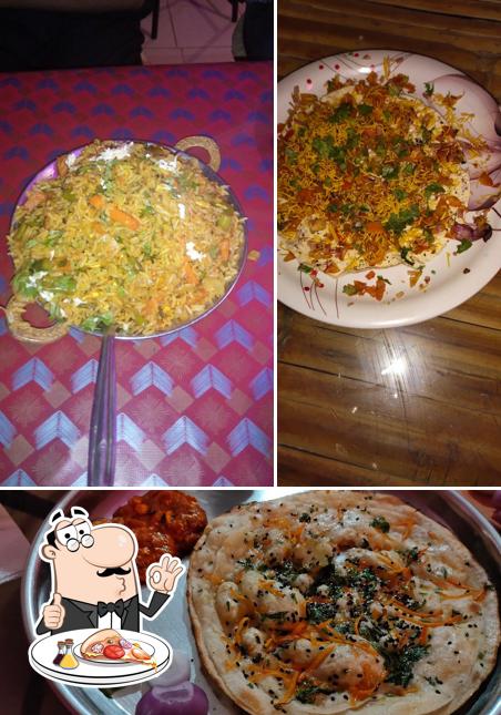 Get pizza at Pink Rajasthani Family Restaurant and Dhaba