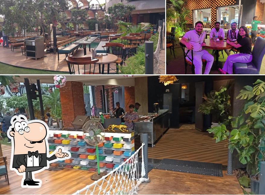 Take a seat at one of the tables at Green Leaf Family Restaurant, Lounge and Pub kalyan
