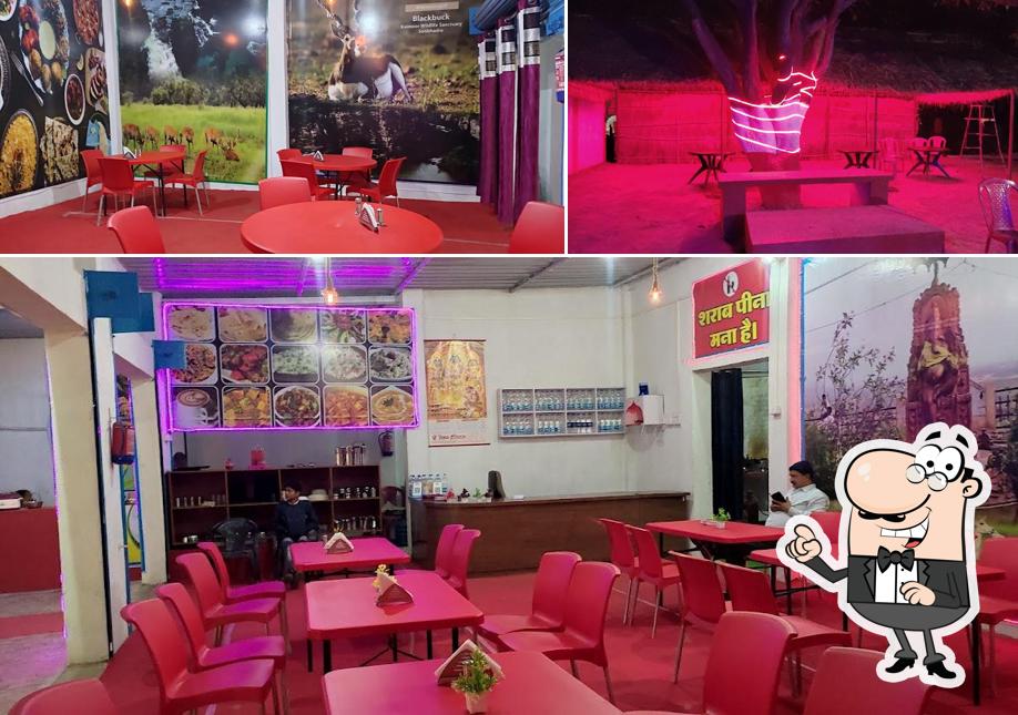 Take a seat at one of the tables at Badahar Dabha & Restaurant