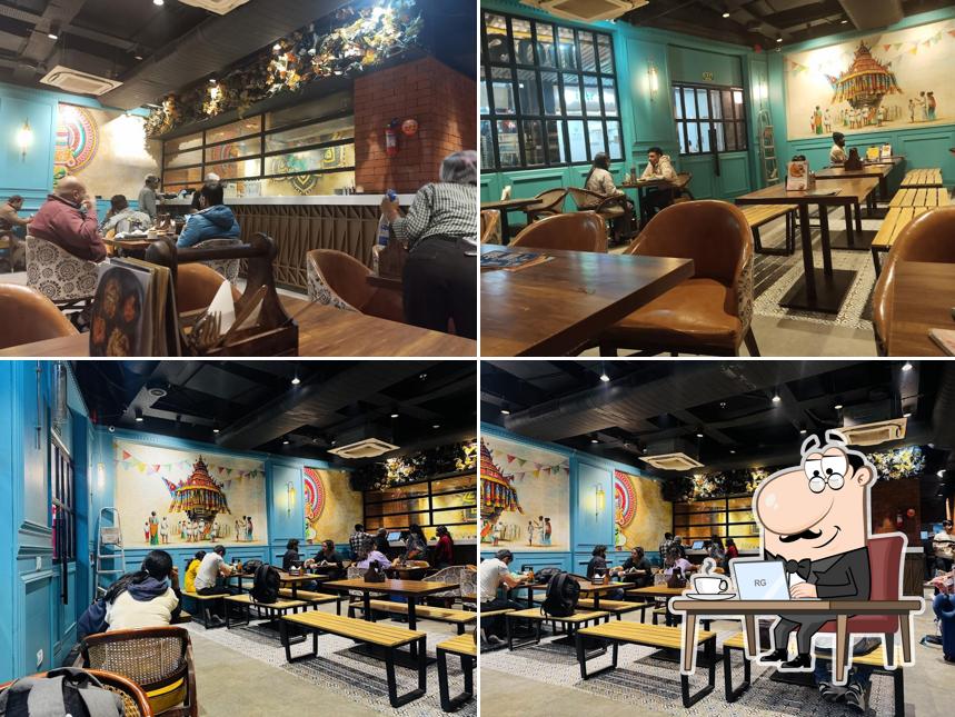 Take a seat at one of the tables at Dosa Planet