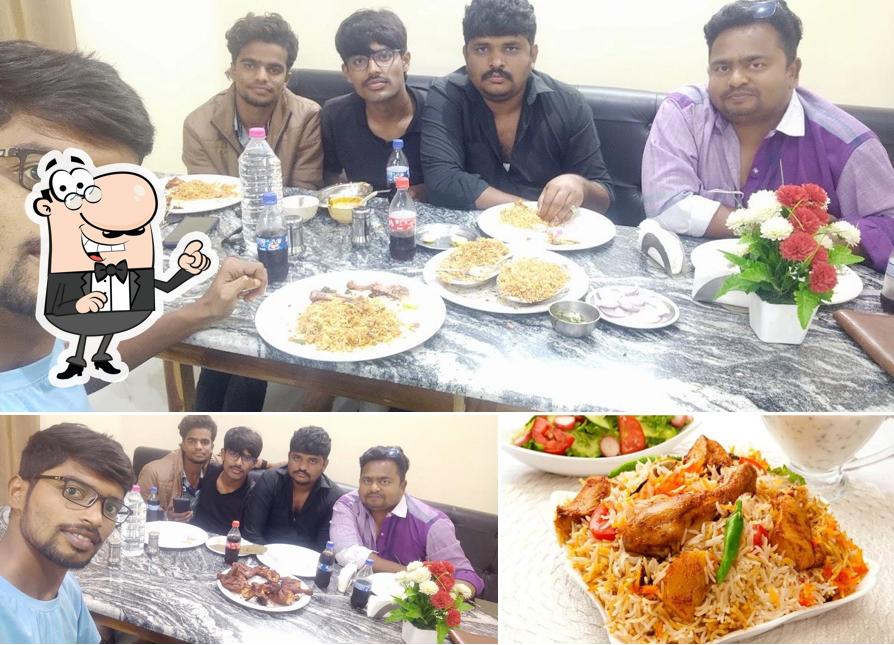 Check out the photo displaying interior and food at TAJ KABAB