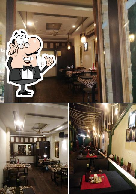Take a seat at one of the tables at Hotel Alisha Take away