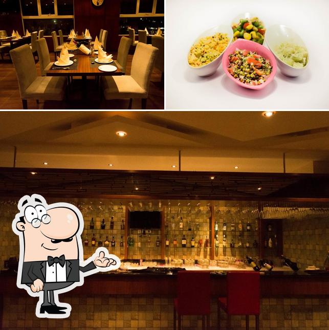 The picture of interior and food at Seafood Dot Grill