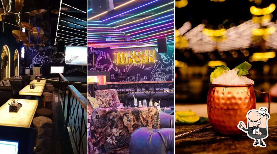 Take a seat at one of the tables at Toksik Lounge & Bar