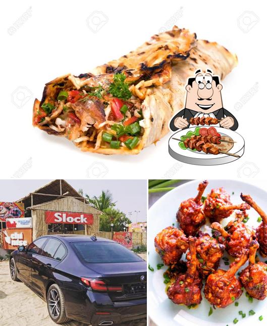 Check out the picture showing food and exterior at Taj Chicken Shawarma