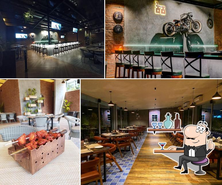 Take a seat at one of the tables at Theth Masala Restaurant & Cafe Gandipet