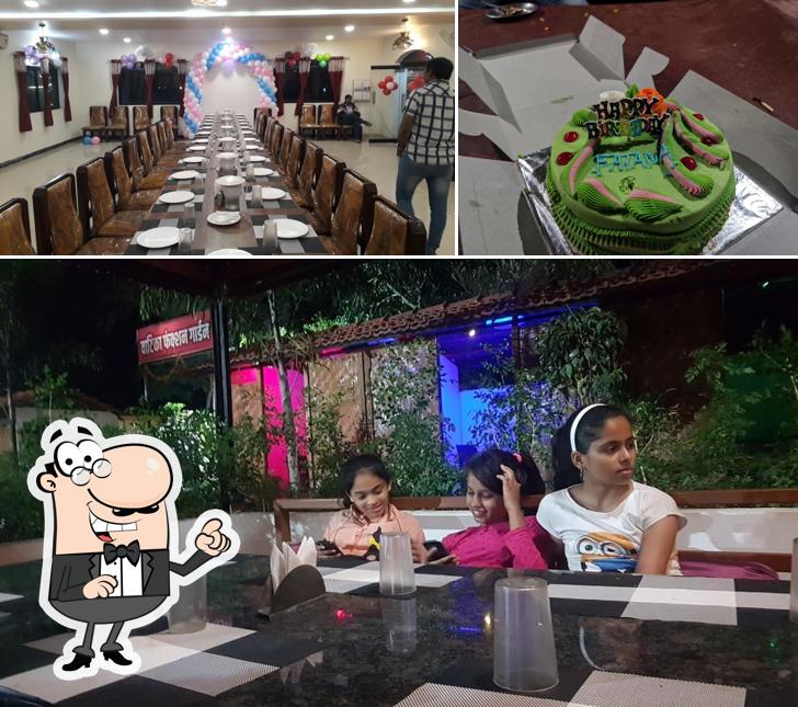 The picture of Vatika Family Resto-Bar’s interior and cake
