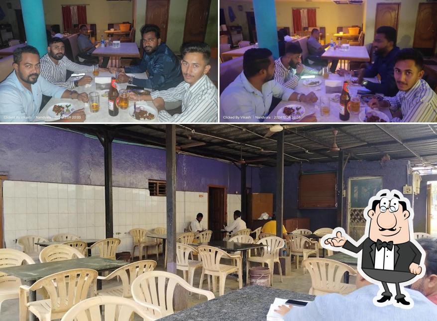 Take a seat at one of the tables at Annapoorna Bar and Restaurant