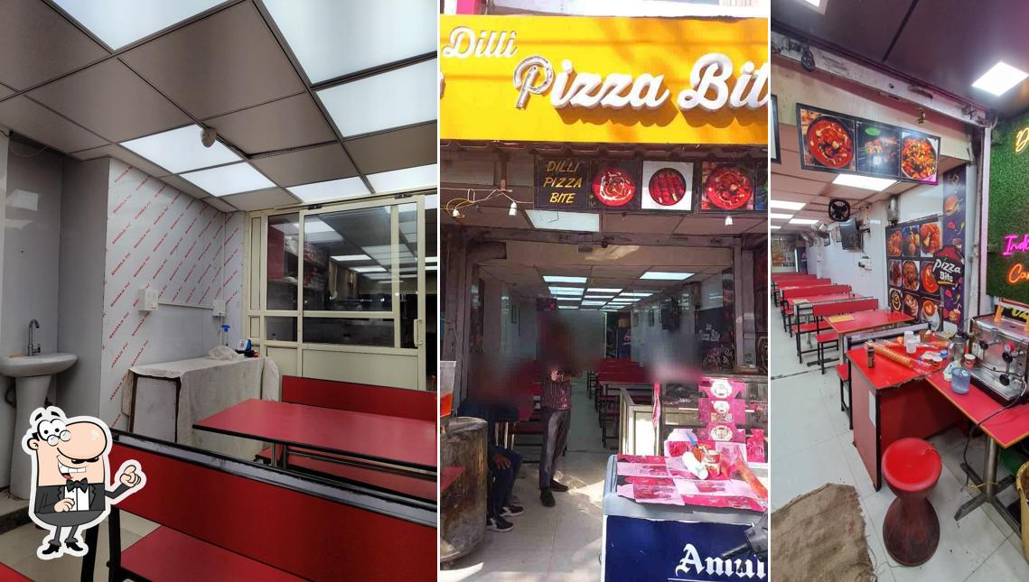 Take a seat at one of the tables at Dilli Pizza Bite