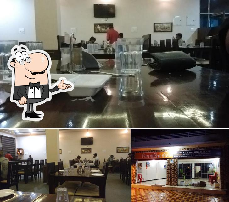 Take a seat at one of the tables at Hotel Shiv Shakti