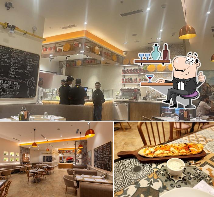 Check out how Si Nonna’s – The Original Sourdough Pizza, Phoenix Mall of the Millennium Wakad, Pune looks inside