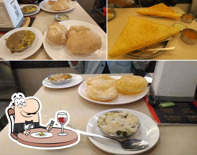 This is the photo showing food and dining table at Navtara Veg Restaurant