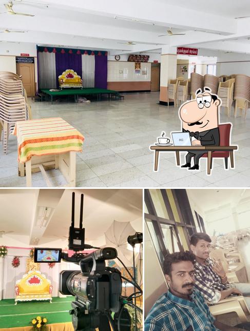 Take a seat at one of the tables at SRI VENKATESHWARA MESS