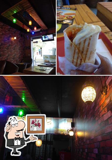 Check out the photo depicting interior and exterior at BURGER INN