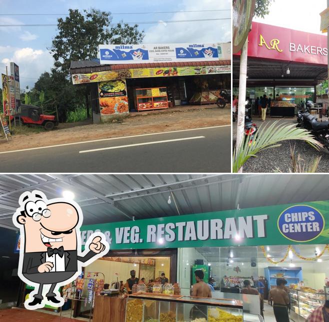 Take a seat at one of the tables at AR Vegetarian Restaurant and Bakery