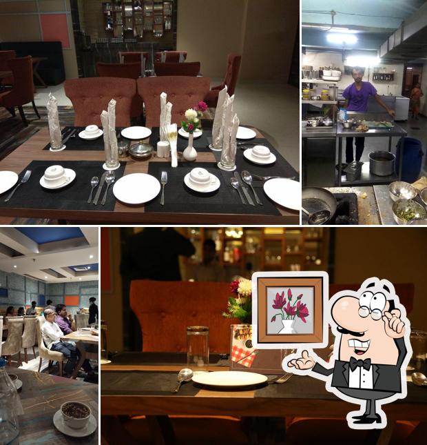 Take a seat at one of the tables at Silver Spoon Restaurant