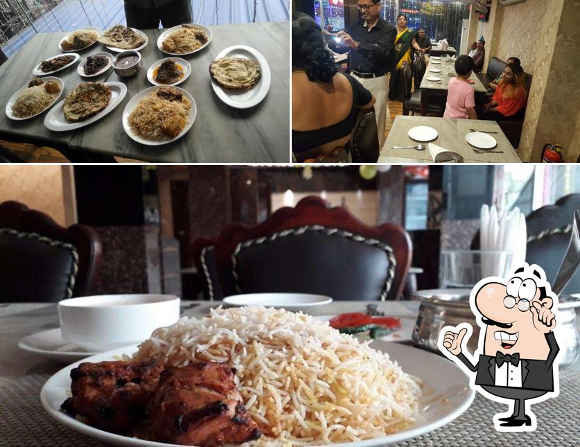 Take a seat at one of the tables at Aliah Restaurant & Banquet