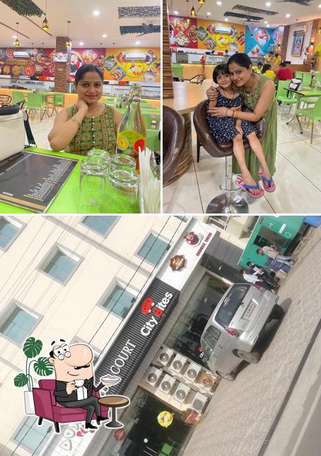 Take a seat at one of the tables at Dosa Plaza Food Court