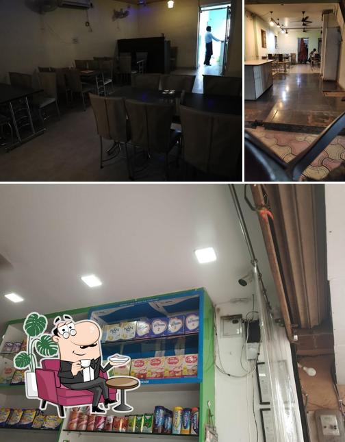 Take a seat at one of the tables at Hyderabadi Flavours