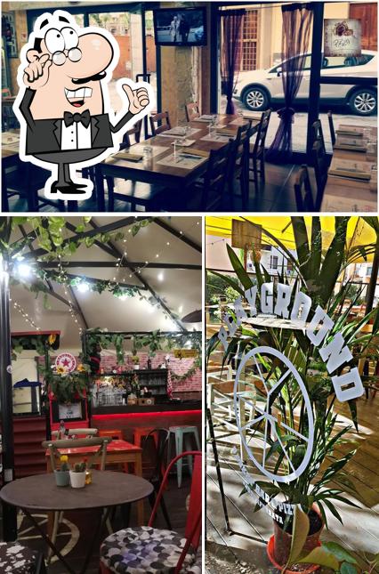 Siediti a un tavolo di Playground Cocktail e Pizza