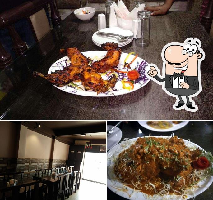 Check out the picture showing interior and dining table at Kings Landing: Fine Dine Restaurant