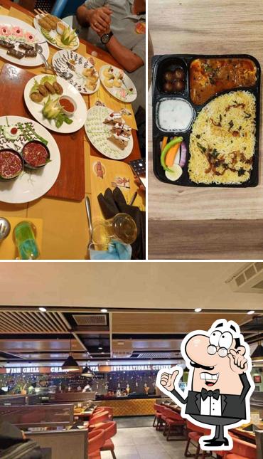 Take a seat at one of the tables at AB's - Absolute Barbecues Vijayawada, Andhra Pradesh