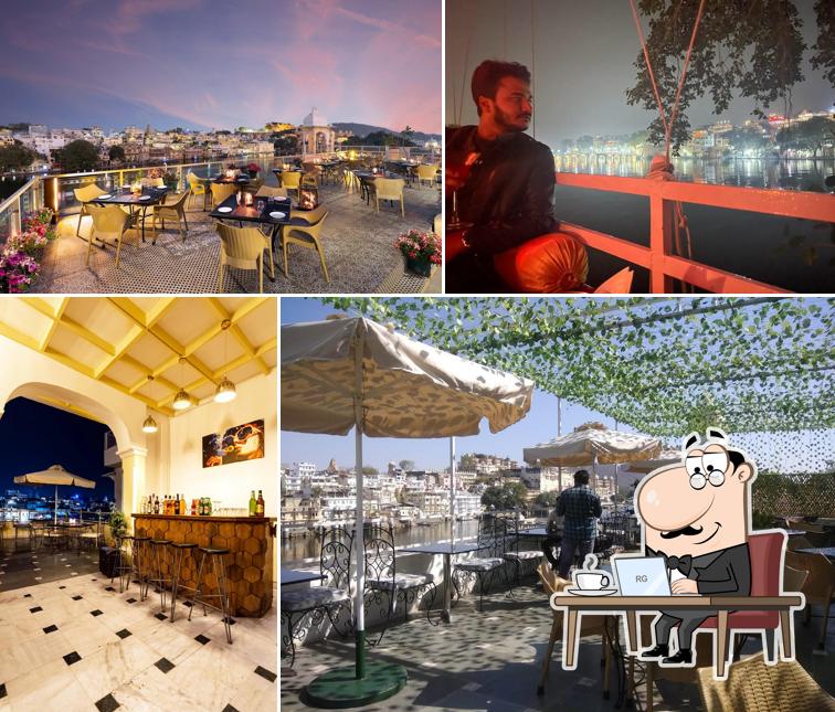 Take a seat at one of the tables at Shamiana Roof Top Restaurant & Lounge