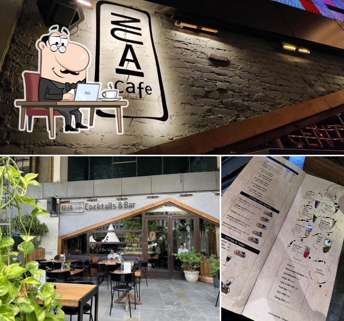 Take a seat at one of the tables at Nua-cafe Aerocity