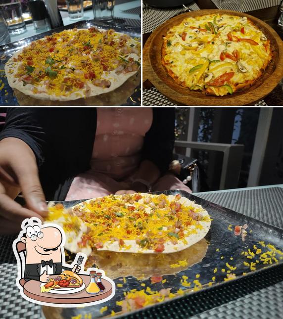 Try out pizza at Kastura Veg