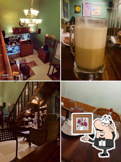 Take a seat at one of the tables at Abar Baithak The coffee shop