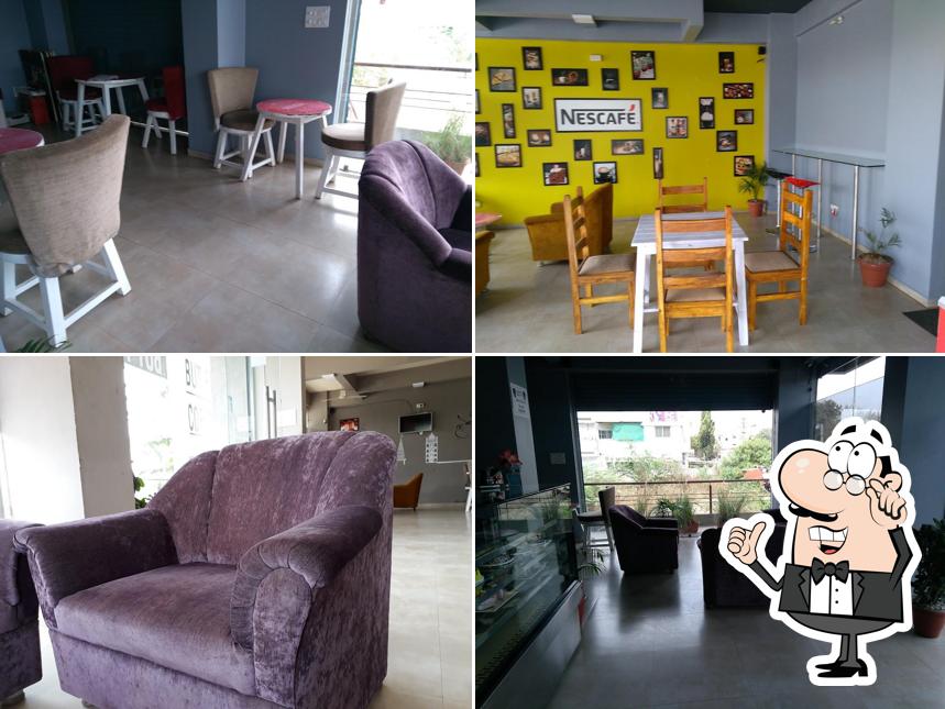 Take a seat at one of the tables at Nescafe