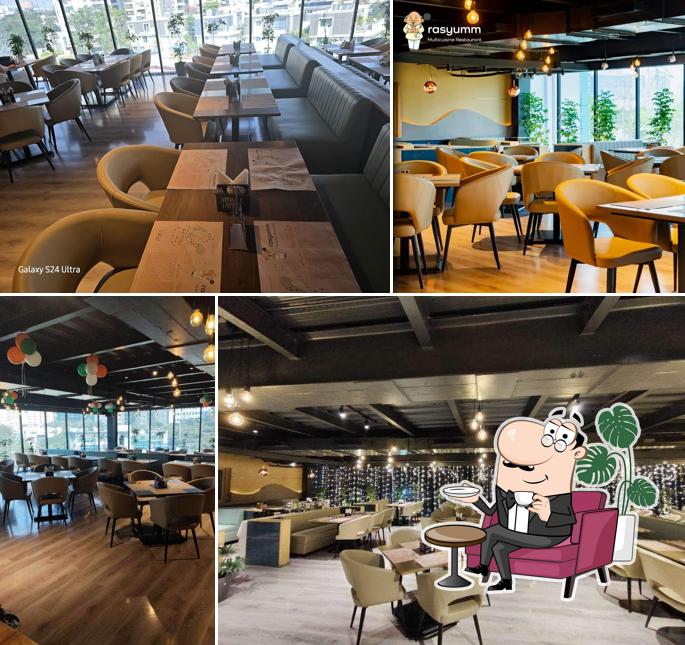 Take a seat at one of the tables at Rasyumm Gachibowli Take a seat at one of the tables at Rasyumm Gachibowli