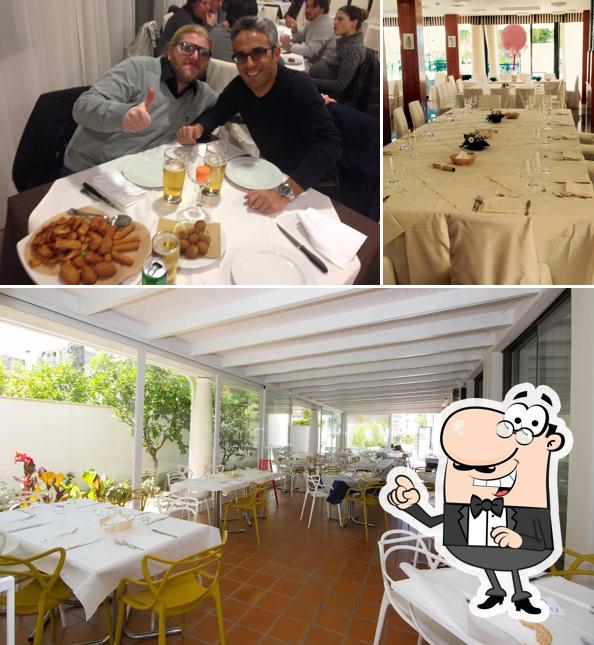 La immagine della interni e tavolo da pranzo di Hotel Jerry Grottammare