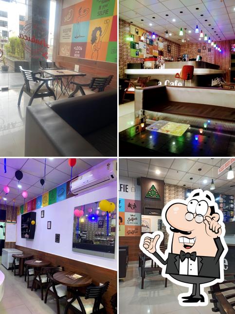 Take a seat at one of the tables at Arabica cafe