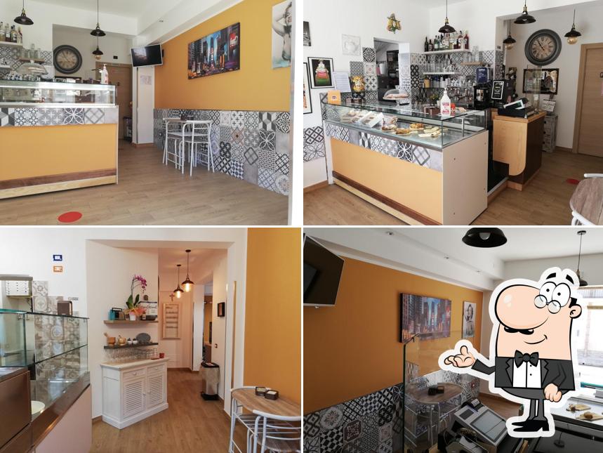 Dai un'occhiata agli interni di Ohana caffetteria pizzeria