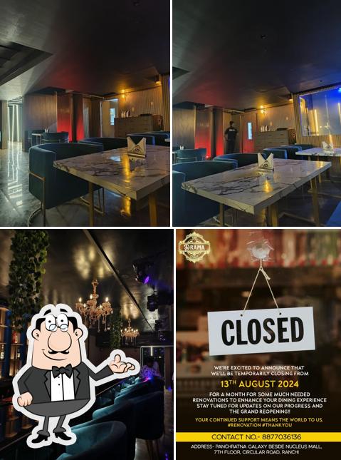 Take a seat at one of the tables at Drama Club & Lounge