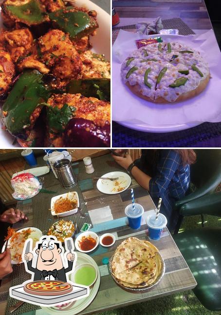 Get pizza at New Roti Masala Restaurant