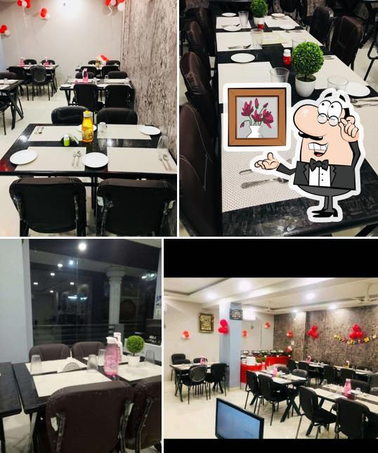 Take a seat at one of the tables at SHREE THAKUR JI RESTAURANT